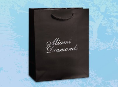 White Paper Bag with Handles decorated with Miami North Wear logo to be used for shopping and perfect for retail stores