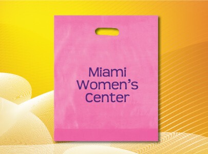 Pink, plastic bag with die cut handle decorated with Miami Women’s Center logo perfect for tradeshows and cancer walks and events