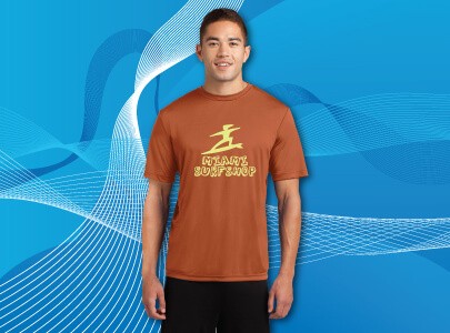 Man wearing orange, short sleeved, cotton T-Shirt screen-printed with Miami Surfshop logo for Florida